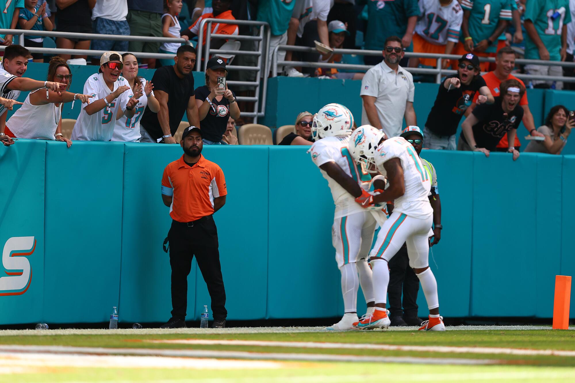 Tyreek Hill of the Miami Dolphins and Jaylen Waddle of the Miami Dolphins celebrate after Hill's receiving touchdown.