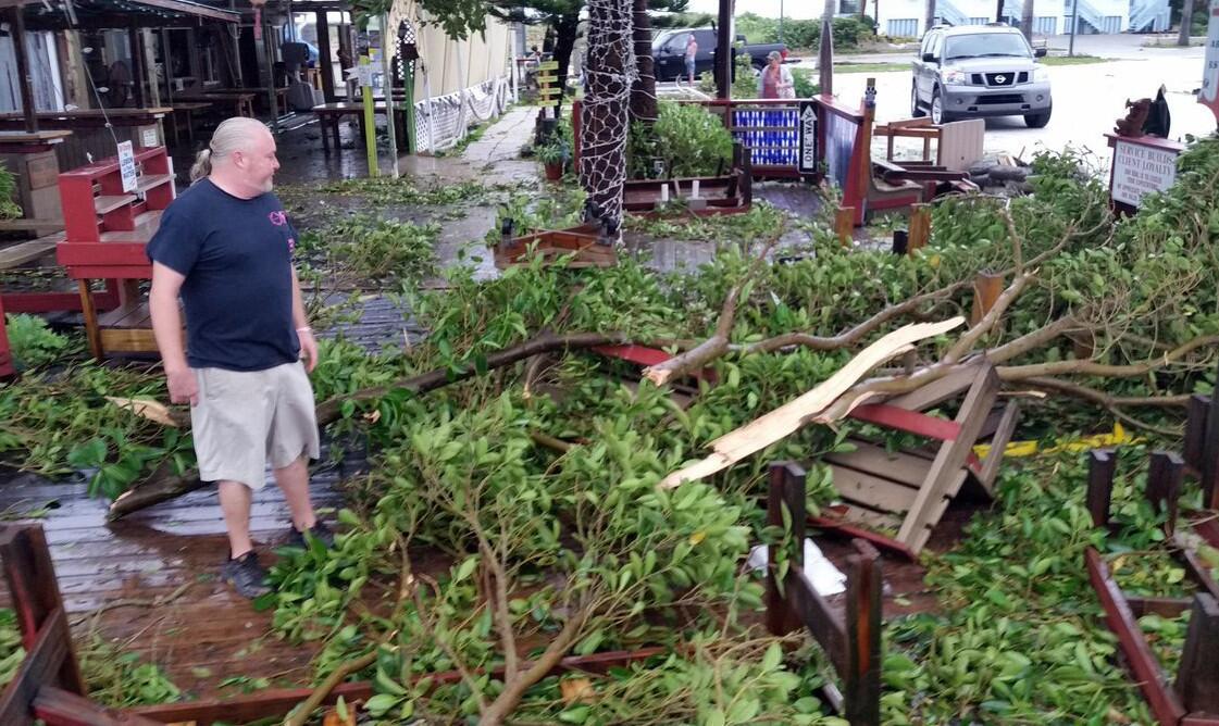 Ryan Stasa surverys the damage at Archie's Seabreeze in Fort Pierce, Fla., Friday, Oct. 7, 2016, after Hurricane Matthew passed through.
