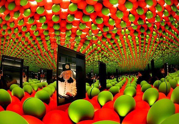 A miner looks at a large-scale crystal structure at a minerals exhibition at Castle Freudenstein in Freiberg, Germany. More than 5,000 minerals, gemstones and meteorites are on display.