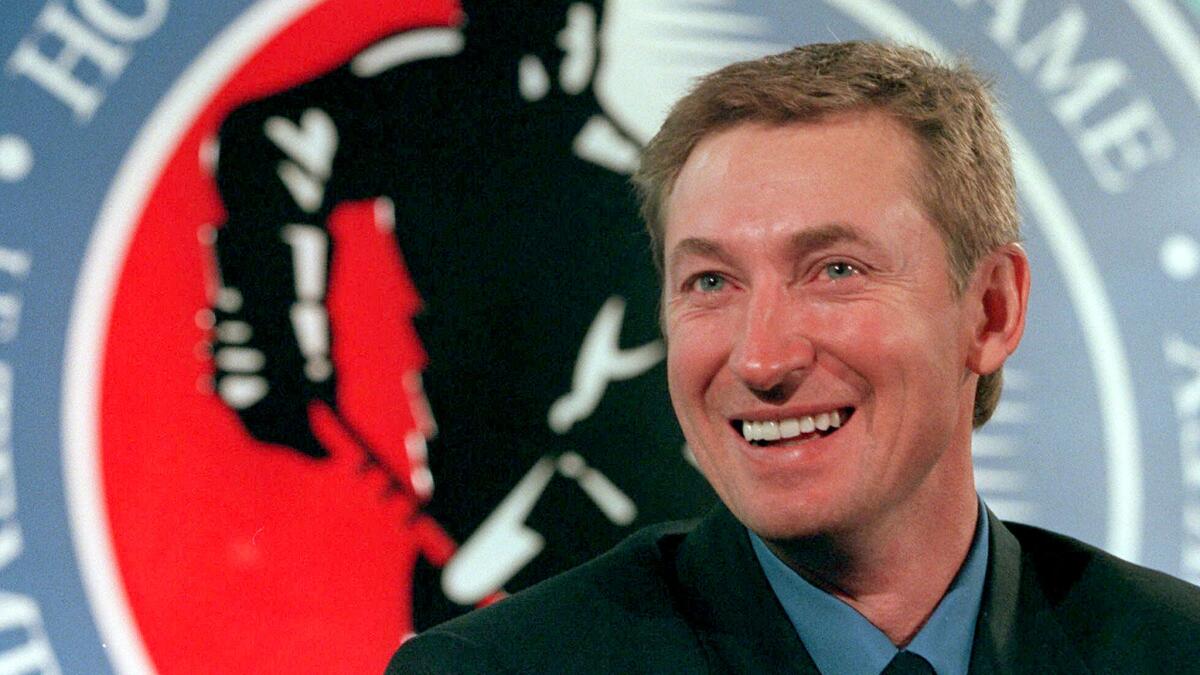 Wayne Gretzky is all smiles during his induction ceremony at the Hockey Hall of Fame in 1999.
