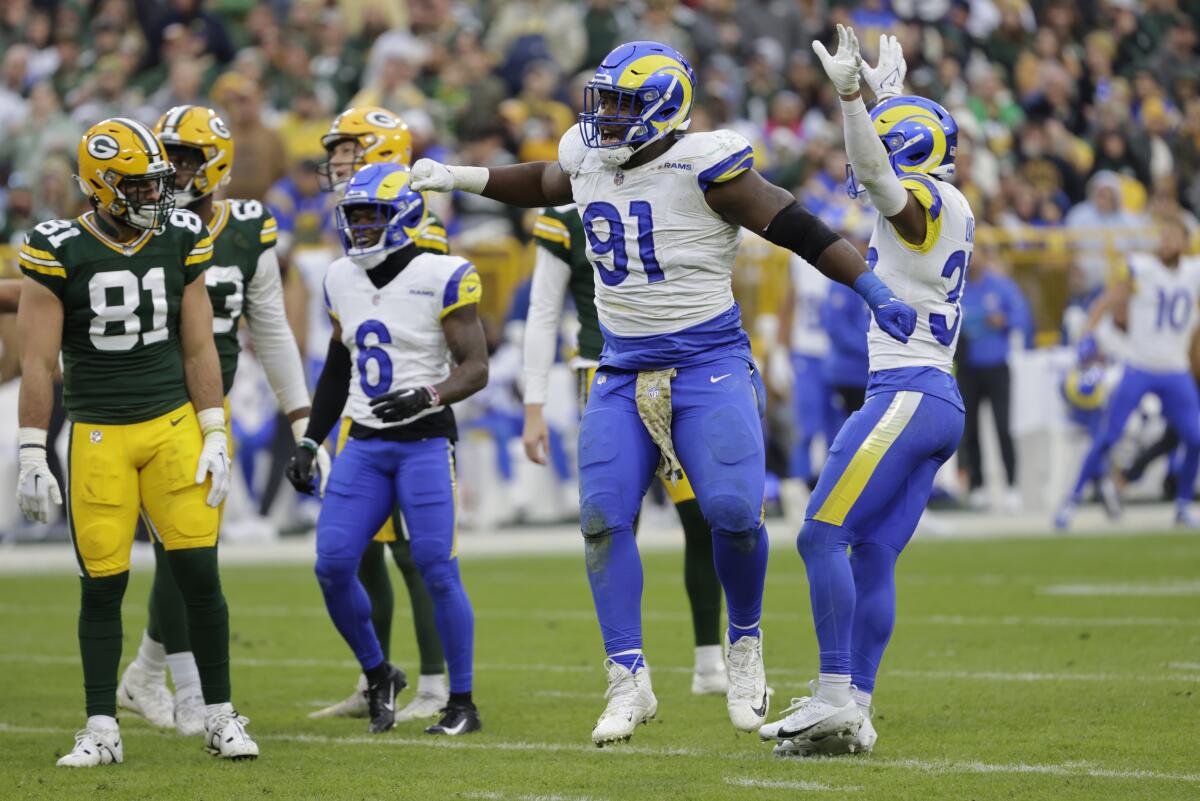Rams defensive tackle Kobie Turner (91) celebrates during an NFC game against the Green Bay Packers.