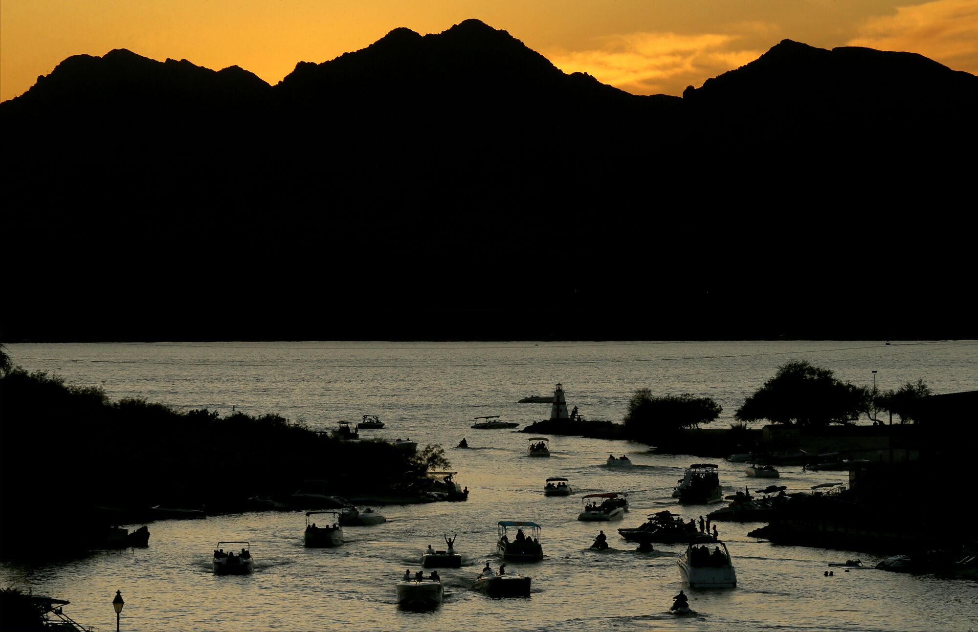 Boaters navigate a channel in Lake Havasu.