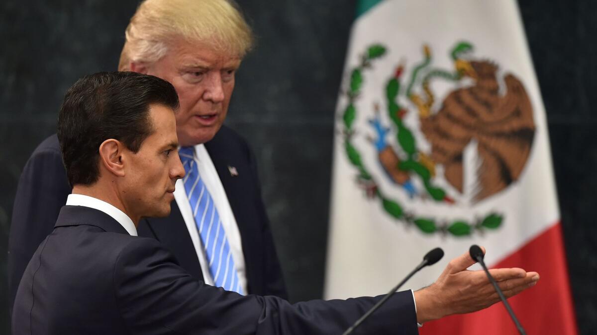 Mexican President Enrique Pe?a Nieto and then-Republican presidential nominee Donald Trump before a news conference in Mexico City in August.