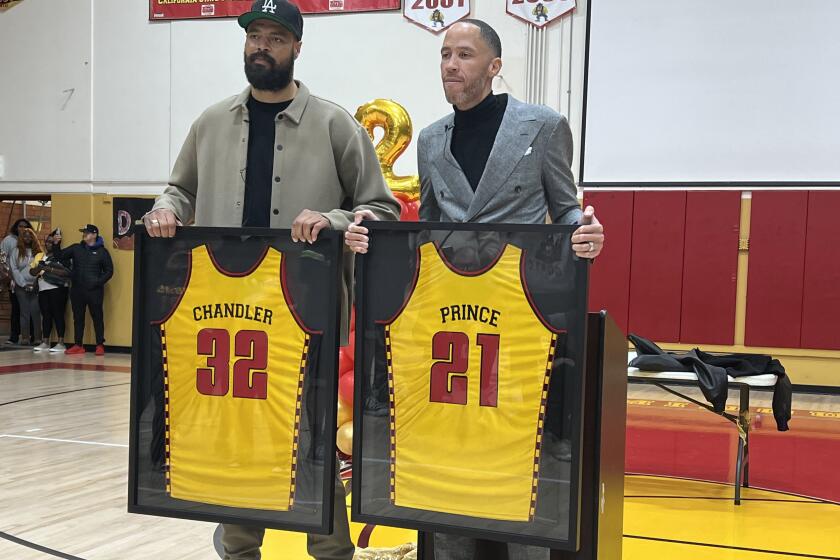Dominguez retired the jerseys of Tyson Chandler and Tayshaun Prince on Friday night.