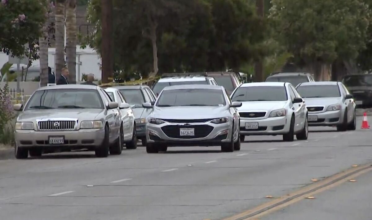 Cars sit on a blocked street