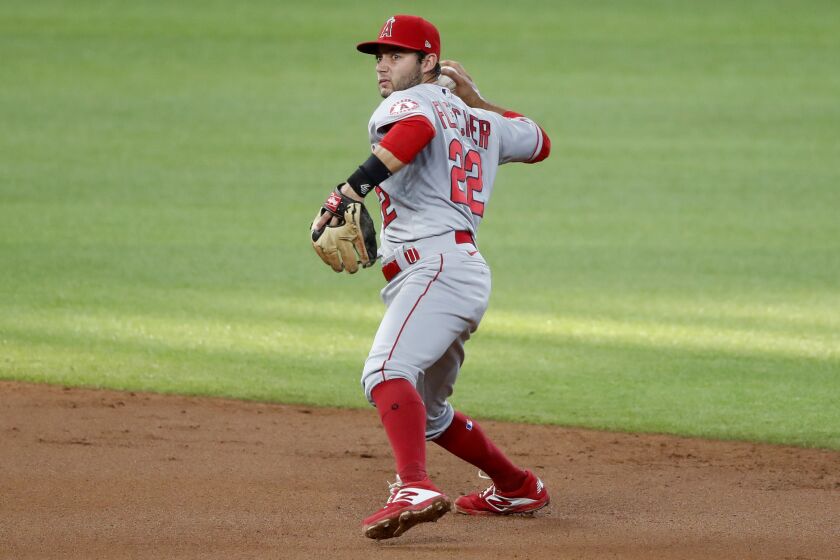 Angels shortstop David Fletcher throws to first during a game against the Texas Rangers on Aug. 8.