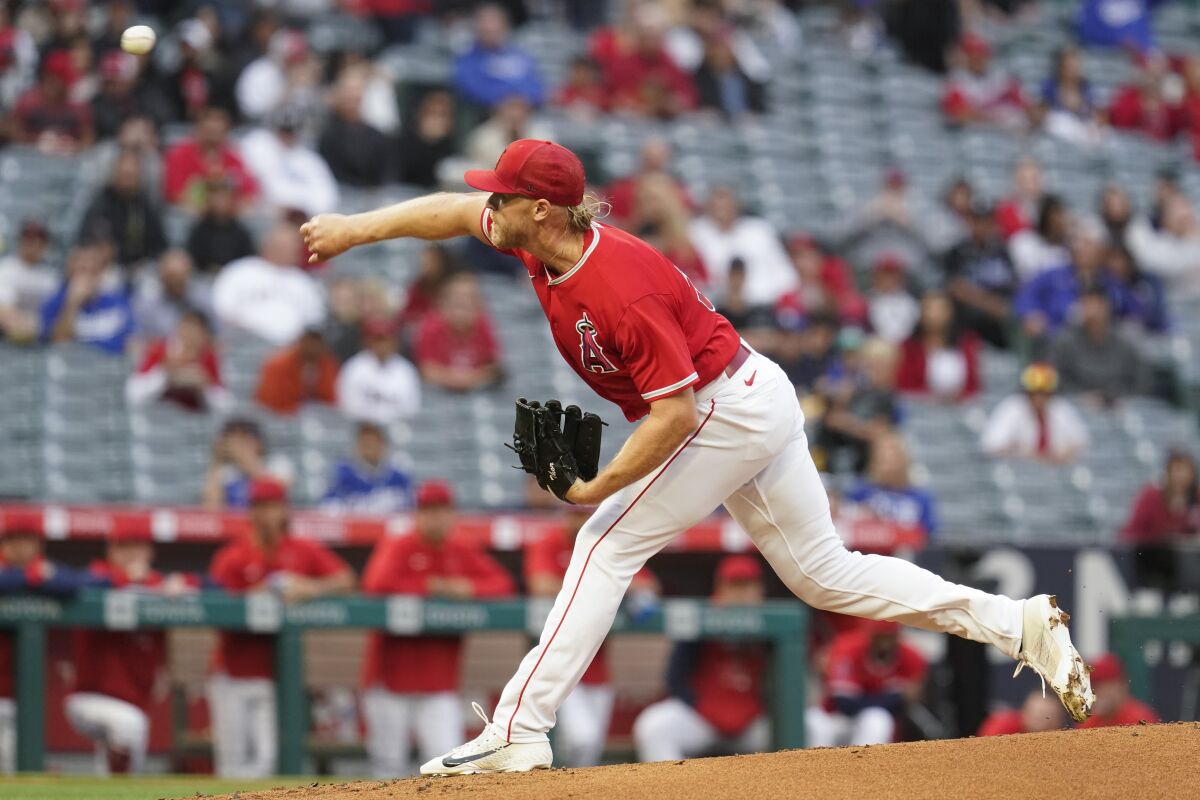 Angels starting pitcher Noah Syndergaard delivers against the Dodgers in the first inning Sunday.