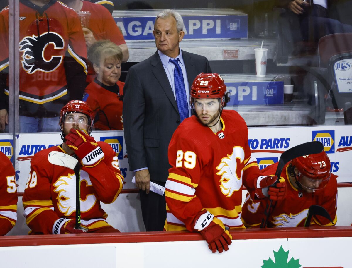 Calgary Flames coach Darryl Sutter watches play during the second period of Game 1 of an NHL hockey second-round playoff series against the Edmonton Oilers on Wednesday, May 18, 2022, in Calgary, Alberta. (Jeff McIntosh/The Canadian Press via AP)