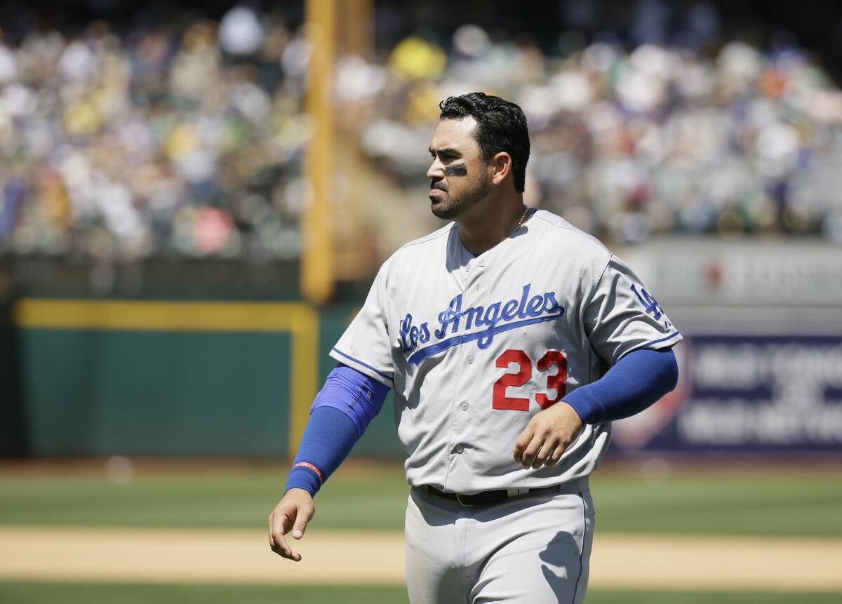 Dodgers first baseman Adrian Gonzalez. shown in a game in Oakland on Aug. 19, was forced out of a game Thursday against the Cincinnati Reds after suffering a bruised right knee.