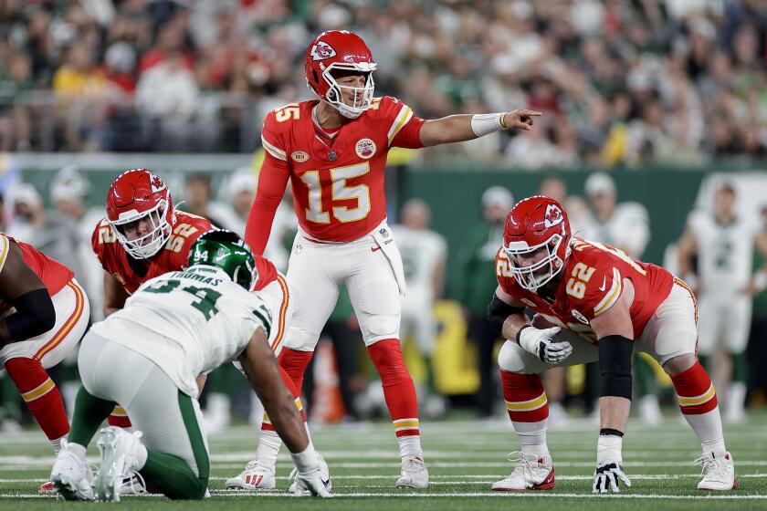 Kansas City Chiefs quarterback Patrick Mahomes (15) calls an audible at the line of scrimmage against the New York Jets during the first quarter of an NFL football game, Sunday, Oct. 1, 2023, in East Rutherford, N.J. (AP Photo/Adam Hunger)