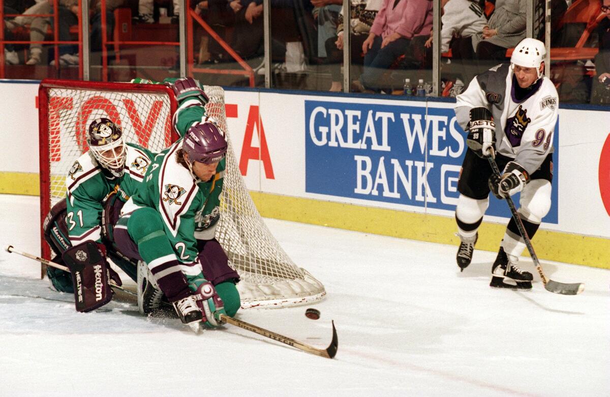 Wayne Gretzky, shown in a 1996 game between the Kings and Anaheim, could cause some problems for the Ducks in a simulated game on Friday.
