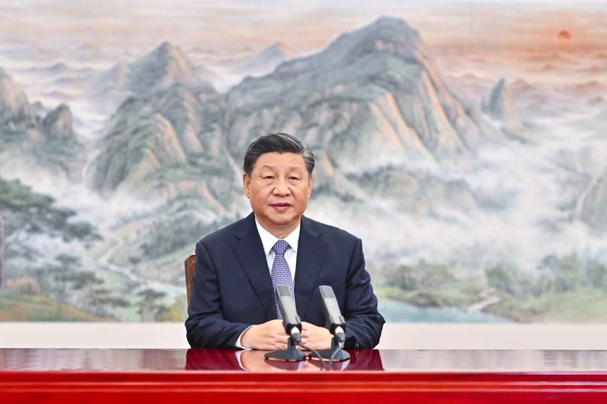 Chinese President Xi Jinping delivering a speech while seated