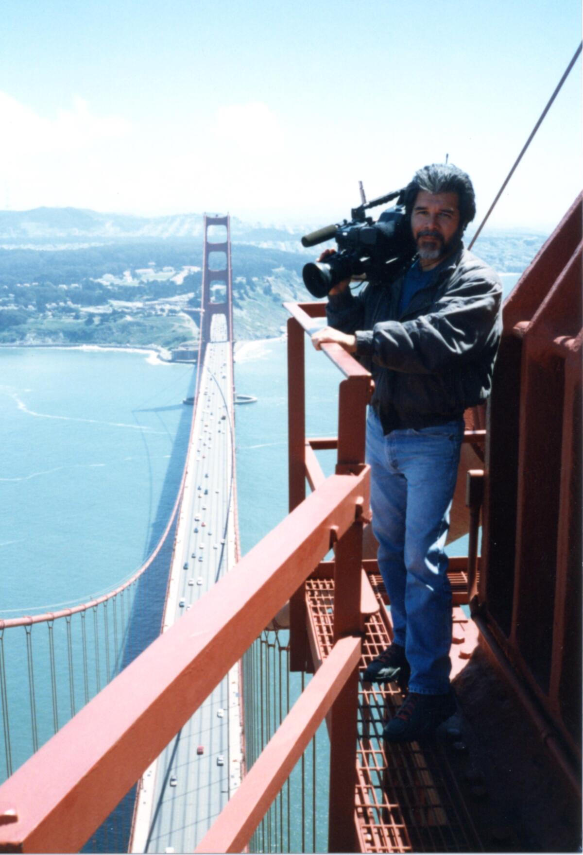 Cameraman Luis Fuerte shoots an episode of "California's Gold" in 1993 atop San Francisco's Golden Gate Bridge.