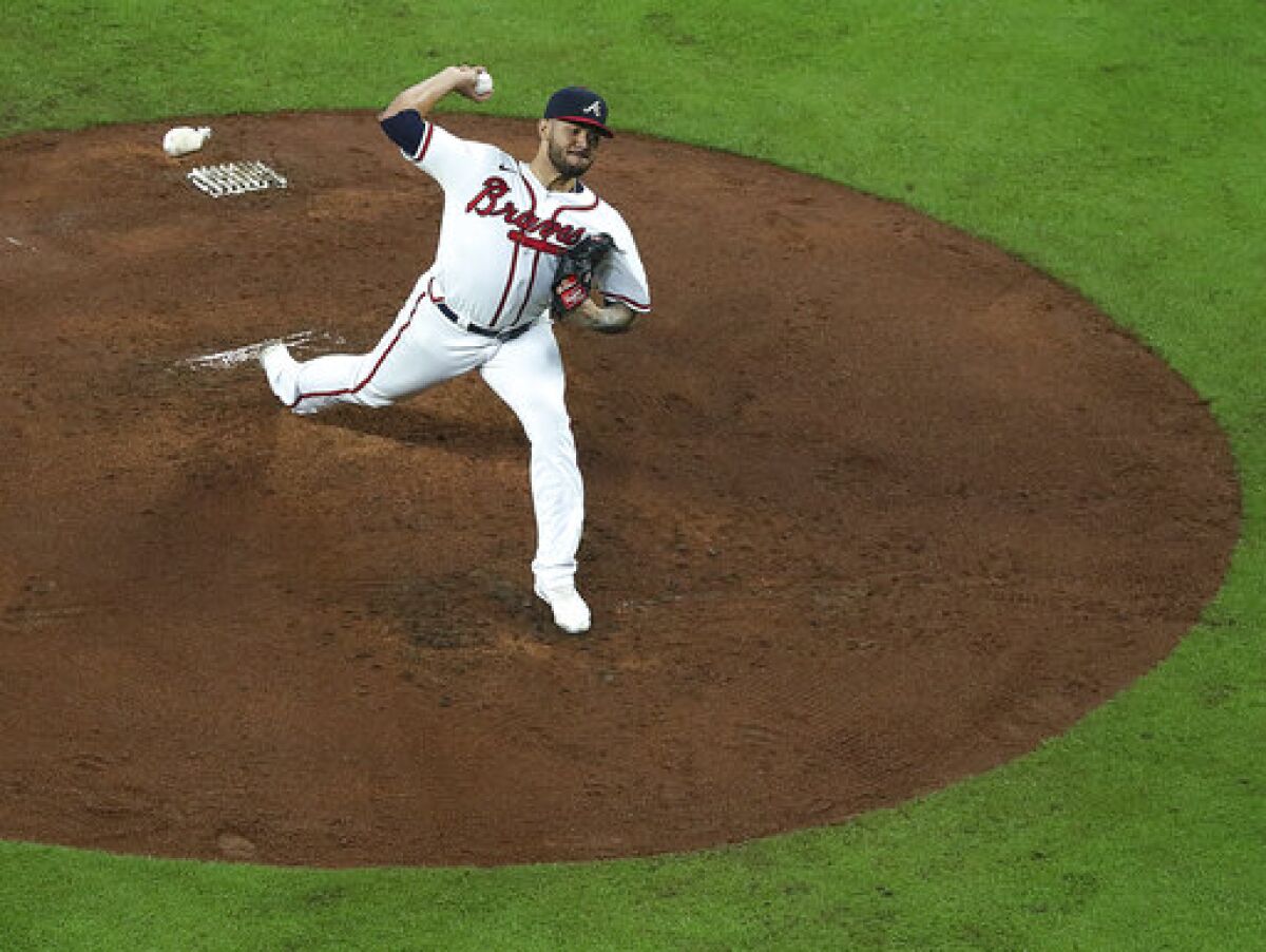 Atlanta Braves starting pitcher Huascar Ynoa delivers to a Colorado Rockies batter during the fourth inning of a baseball game Wednesday, Sept. 15, 2021, in Atlanta. (Curtis Compton/Atlanta Journal-Constitution via AP)