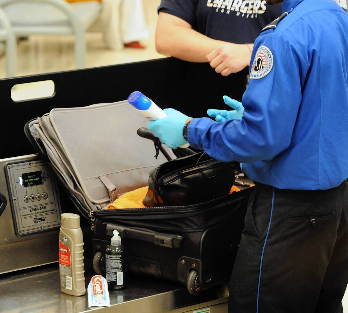 In the U.S., Transportation Security Administration officials are looking into several technologies for liquids screening. Above, a TSA officer discovers unallowable liquids in a passenger's carry-on luggage at the security checkpoint at Hartsfield-Jackson Atlanta International Airport in Atlanta.