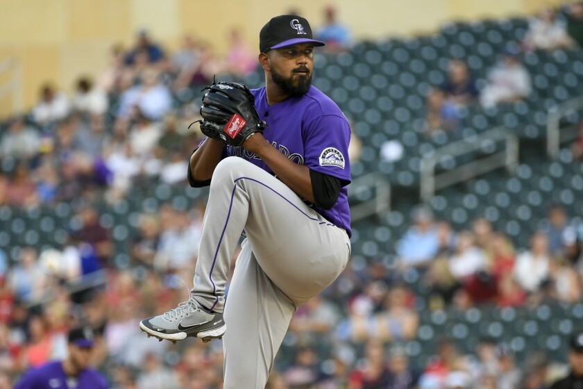 Colorado Rockies pitcher German Marquez winds up during the first inning of the team's baseball game against the Minnesota Twins, Friday, June 24, 2022, in Minneapolis. The (AP Photo/Craig Lassig)