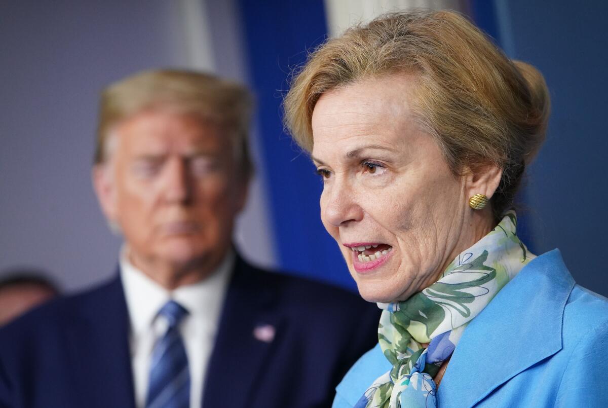 Dr. Deborah Birx, response coordinator for White House Coronavirus Task Force, speaks as President Trump listens during the daily briefing on COVID-19 on Tuesday at the White House.