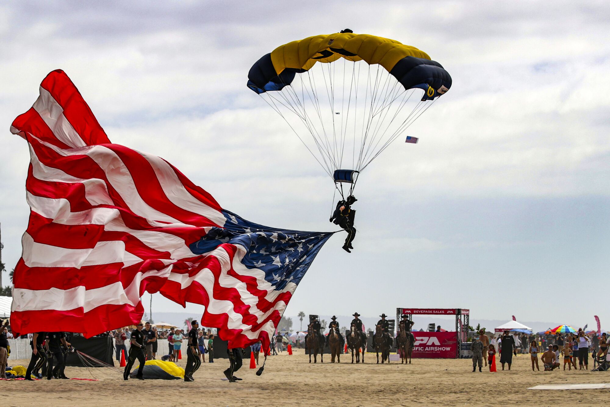 US Navy Leap Frogs perform parachute jumps during the Pacific Airshow
