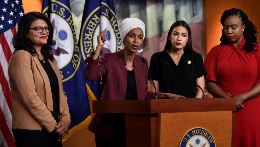 The four representatives targeted by President Donald Trump's tweets appear at a news conference Tuesday to denounce the comments.