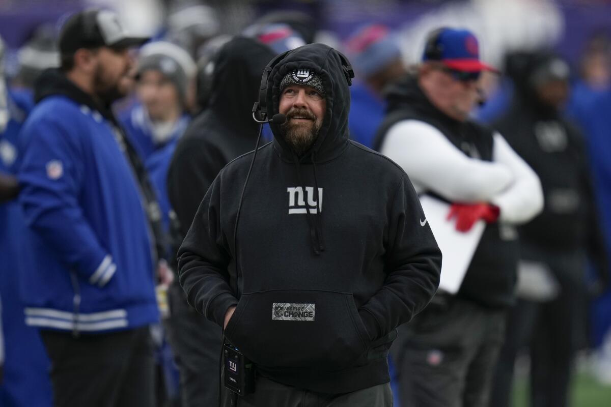 New York Giants coach Brian Daboll walks on the sideline in the first half.