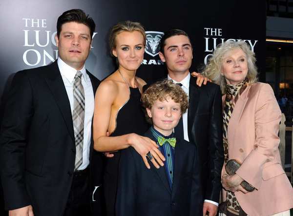 The cast of "The Lucky One" — Jay R. Ferguson, left, Taylor Schilling, Riley Thomas Stewart, Zac Efron and Blythe Danner — arrives at Grauman's Chinese Theatre on April 16 to debut the romantic drama based on Nicholas Sparks' novel. The film opens in theaters April 20.