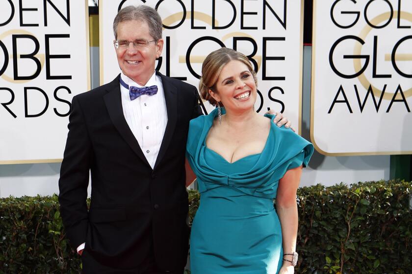 Chris Buck and Jennifer Lee, winners of best animated feature Film for "Frozen," at the Golden Globe Awards show on Jan. 12, 2014, in Beverly Hills.