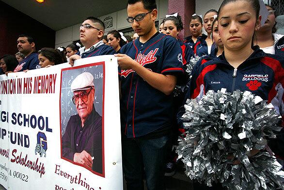 Garfield High School students observe a moment of silence on the front steps of their school in East Los Angeles on Thursday to honor former math teacher Jaime Escalante, who died Tuesday. Escalante taught at the school from 1974 to 1991. See full story