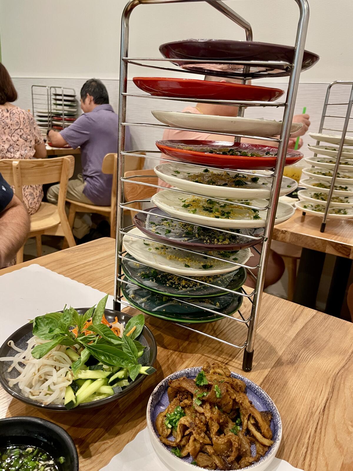 A tower of plates with food on them.