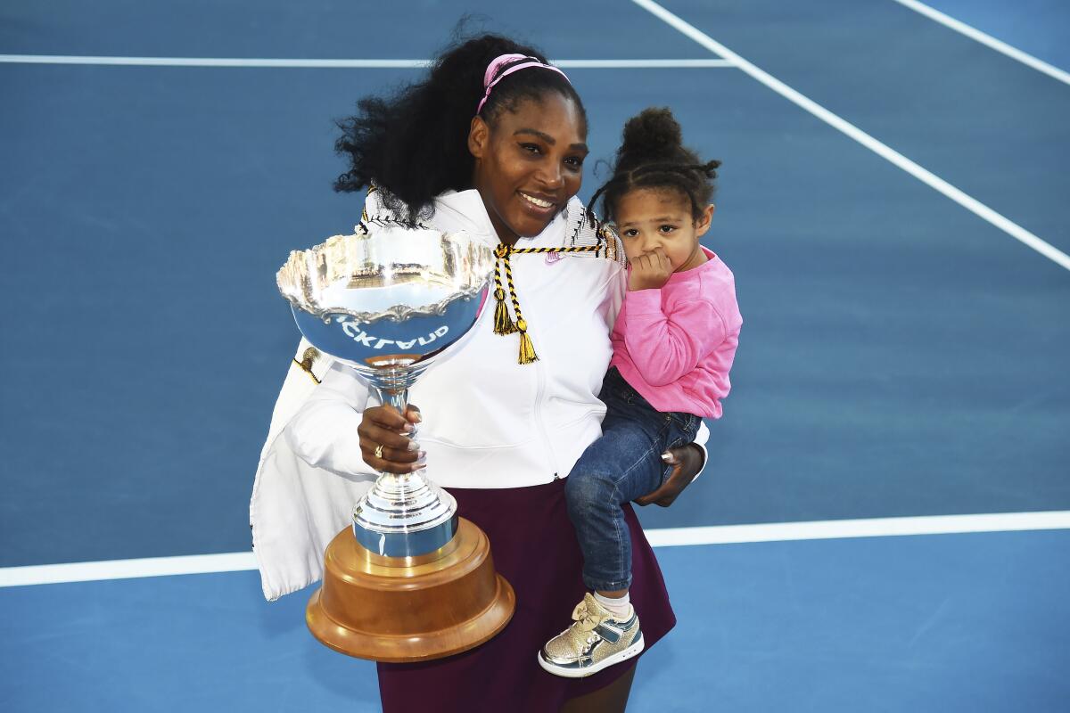 FILE - Serena Williams holds her daughter Alexis Olympia Ohanian Jr., and the ASB trophy after winning her singles finals match against Jessica Pegula at the ASB Classic in Auckland, New Zealand, Sunday, Jan 12, 2020. Serena Williams says she is ready to step away from tennis after winning 23 Grand Slam titles, turning her focus to having another child and her business interests. “I’m turning 41 this month, and something’s got to give,” Williams wrote in an essay released Tuesday, Aug. 9, 2022, by Vogue magazine. (Chris Symes/Photosport via AP, File)
