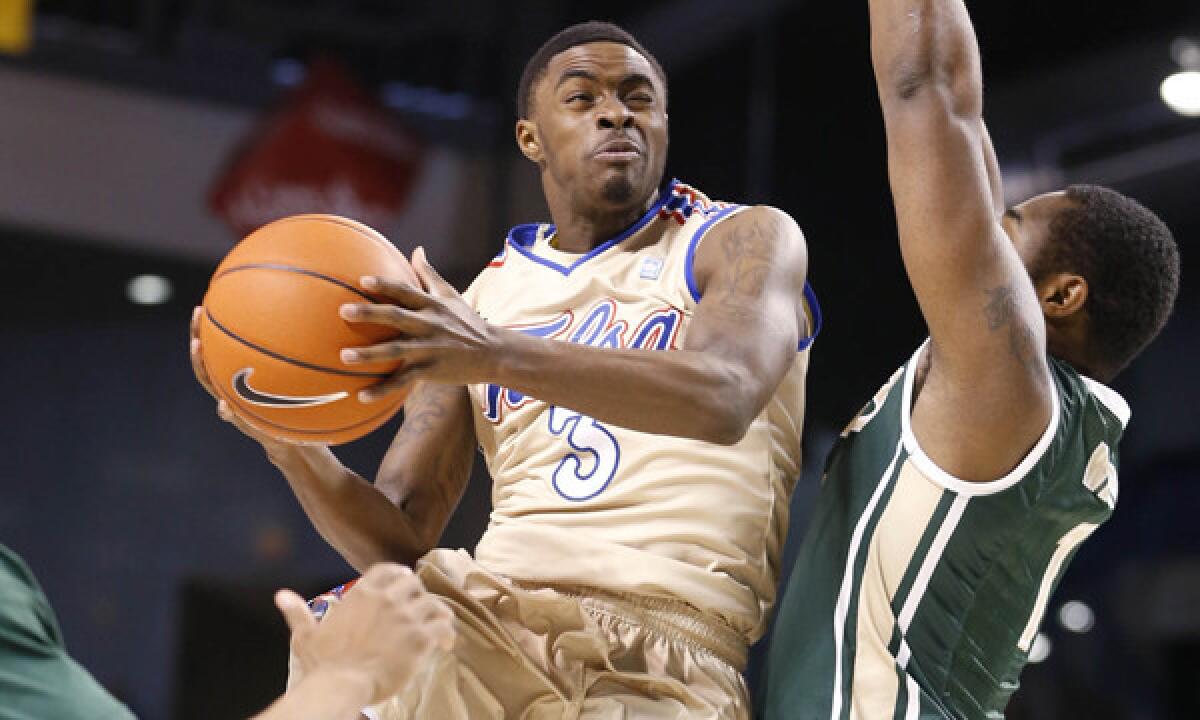 Tulsa's Rashad Ray puts up a shot in front of UAB's Denzell Watts during a Jan. 25 game. Tulsa will play UCLA in the first round of the NCAA tournament Friday.