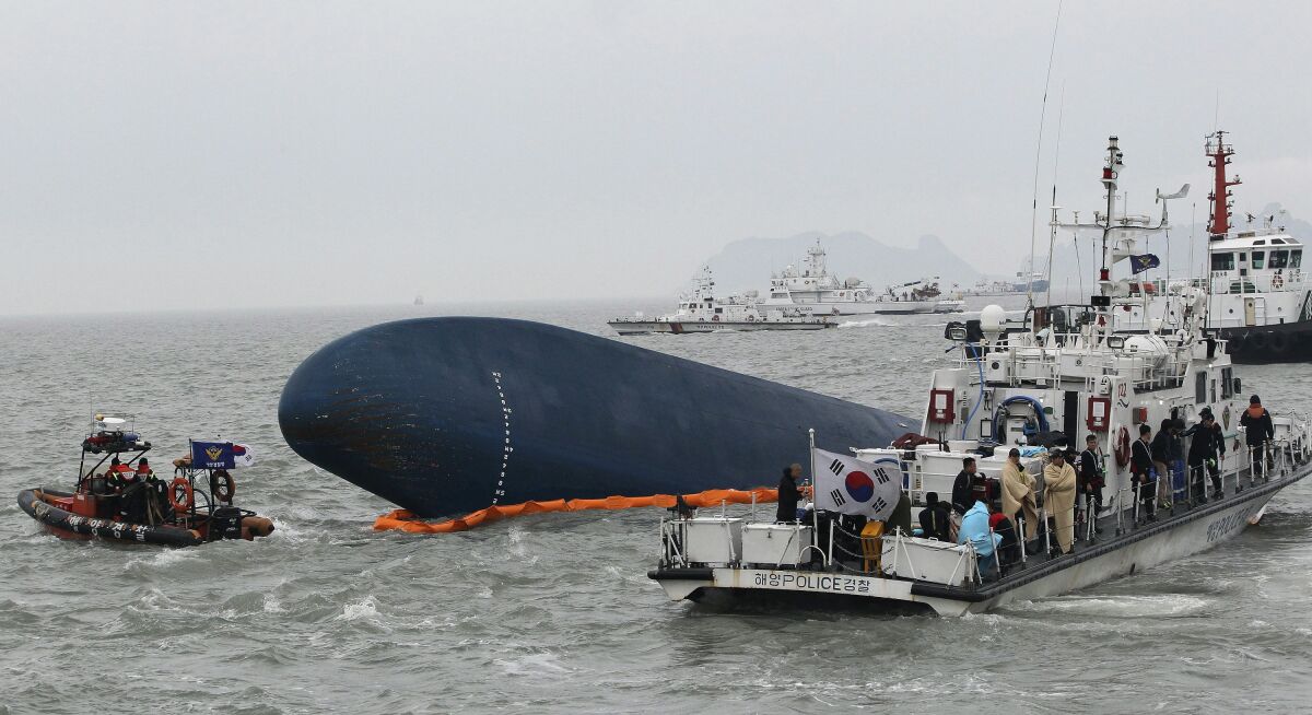 South Korean Coast Guard boats float near the sunken Sewol ferry.
