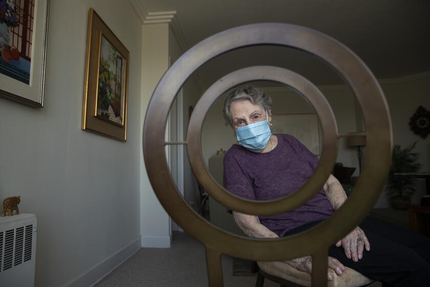 LOS ANGELES, CA-MAY 8, 2020: Elaine Lubkin, 87, is photographed inside her home at Park LaBrea in Los Angeles. Lubkin, who is a very active senior citizen, misses all the things she used to do before the coronavirus outbreak such as attending classes, serving on a committee at the Ebell Club, participating in a wisdom circle at a local synagogue, and eating out with friends. (Mel Melcon/Los Angeles Times)