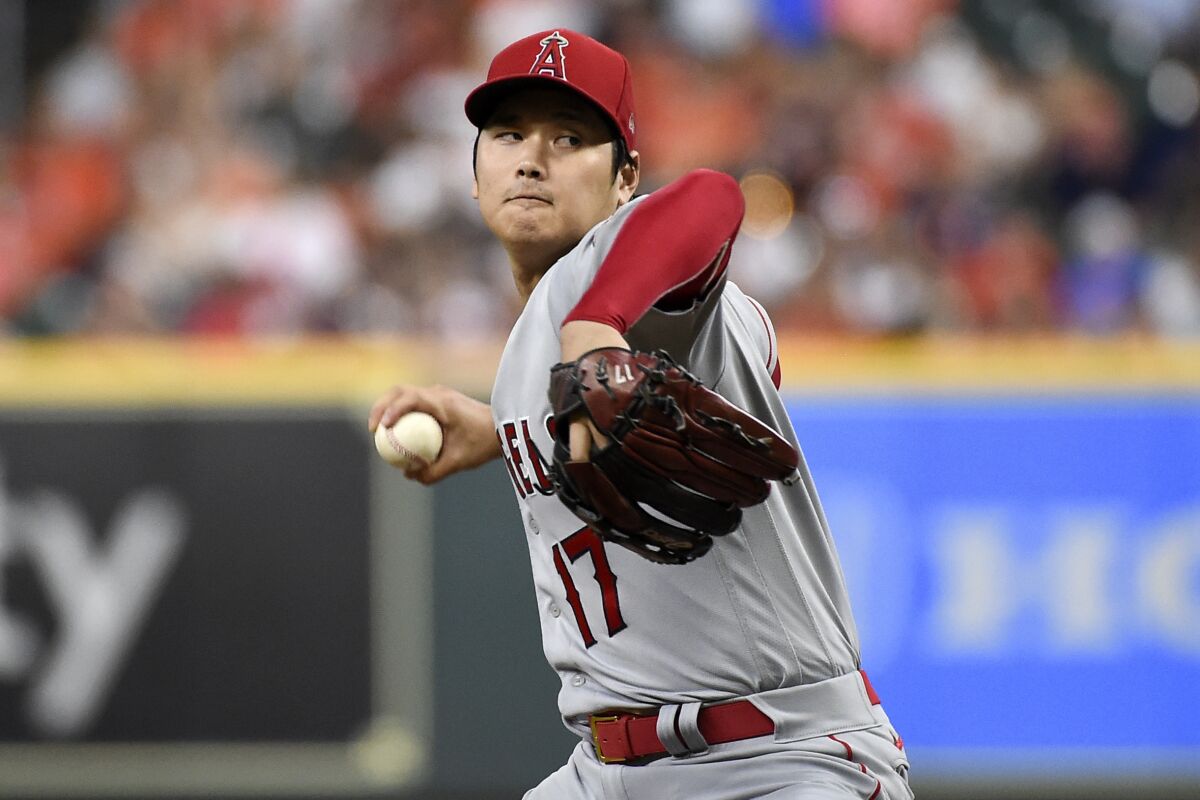 Los Angeles Angels starting pitcher Shohei Ohtani delivers during the first inning of a baseball game against the Houston Astros, Friday, Sept. 10, 2021, in Houston. (AP Photo/Eric Christian Smith)