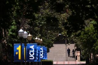 WESTWOOD, CA - AUGUST 15, 2024 - A couple make their way up the stair on the UCLA campus in Westwood on August 15, 2024. (Genaro Molina/Los Angeles Times)