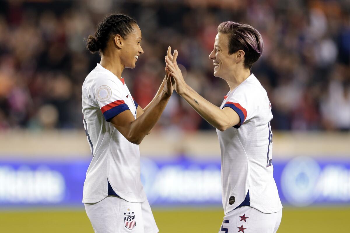 U.S. forwards Lynn Williams and Megan Rapinoe, right, celebrate Williams' goal in a CONCACAF Olympic qualifying match Jan. 31, 2020.