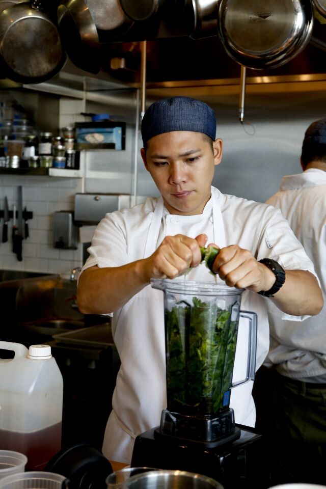 Cook Ryan Wong works in the open kitchen.