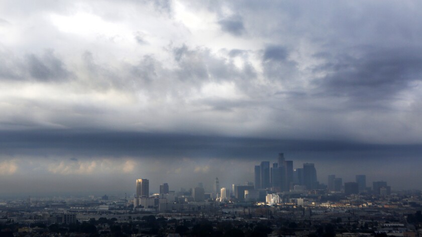 The National Weather Service says rain and hail could hit parts of Los Angeles and Ventura counties this week. Here, clouds move into the Los Angeles basin in a view from Lincoln Heights in December.