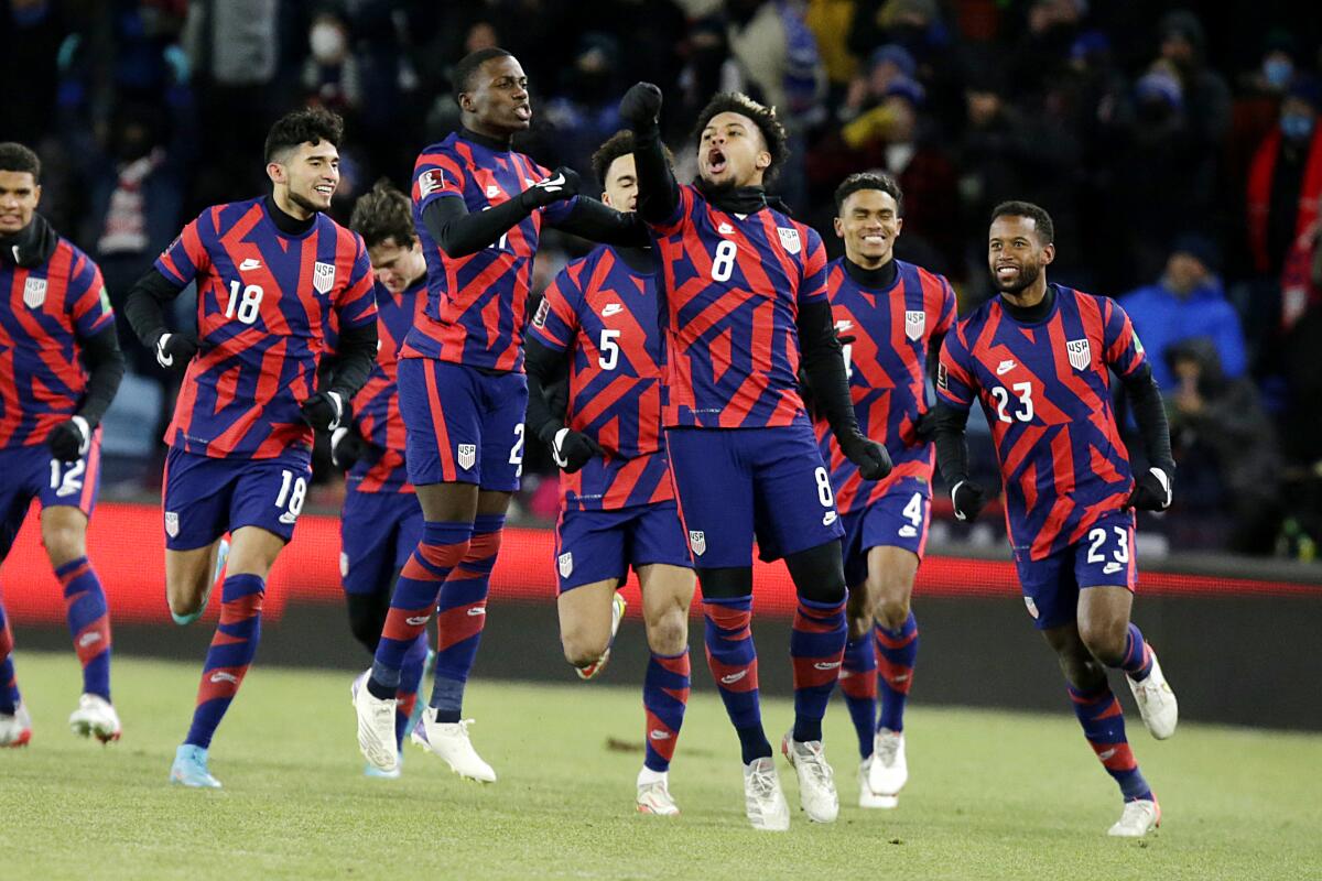 United States' Weston McKennie (8) celebrates a goal with teammates Kellyn Acosta (23), Reggie Cannon (4), Antonee Robinson (5), Tim Weah, (21) and Ricardo Pepi (18) during the first half of the team's FIFA World Cup qualifying soccer match against Honduras, Wednesday, Feb. 2, 2022, in St. Paul, Minn. (AP Photo/Andy Clayton-King)