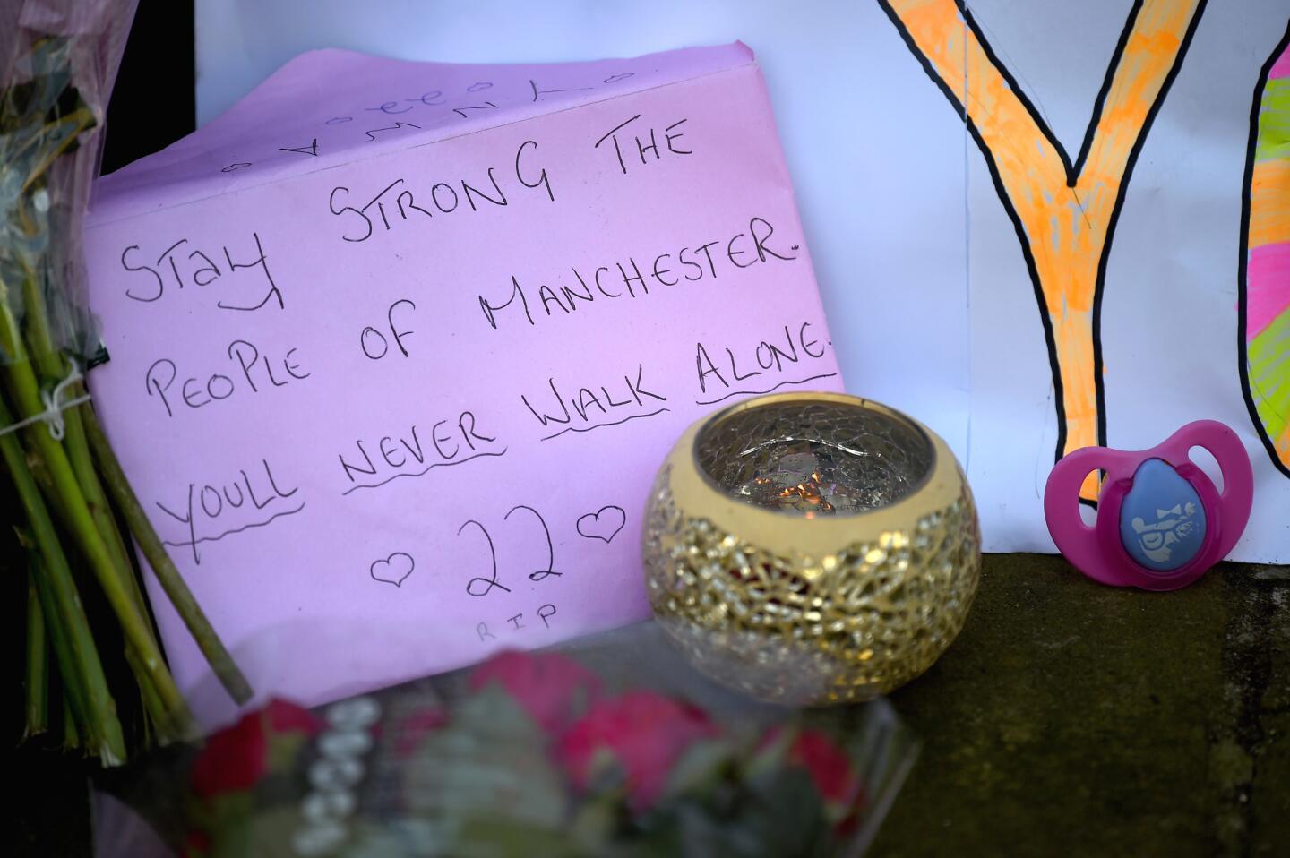Tributes are being left in St. Ann's Square in Manchester, England.