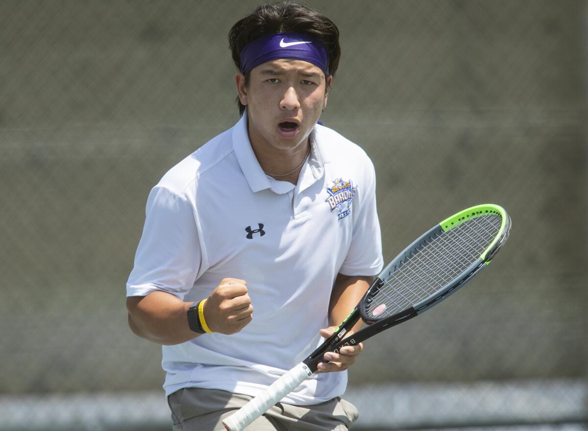 Fountain Valley's Alan Ton celebrates after winning a point against Sage Hill's Grant Gallagher on Wednesday.