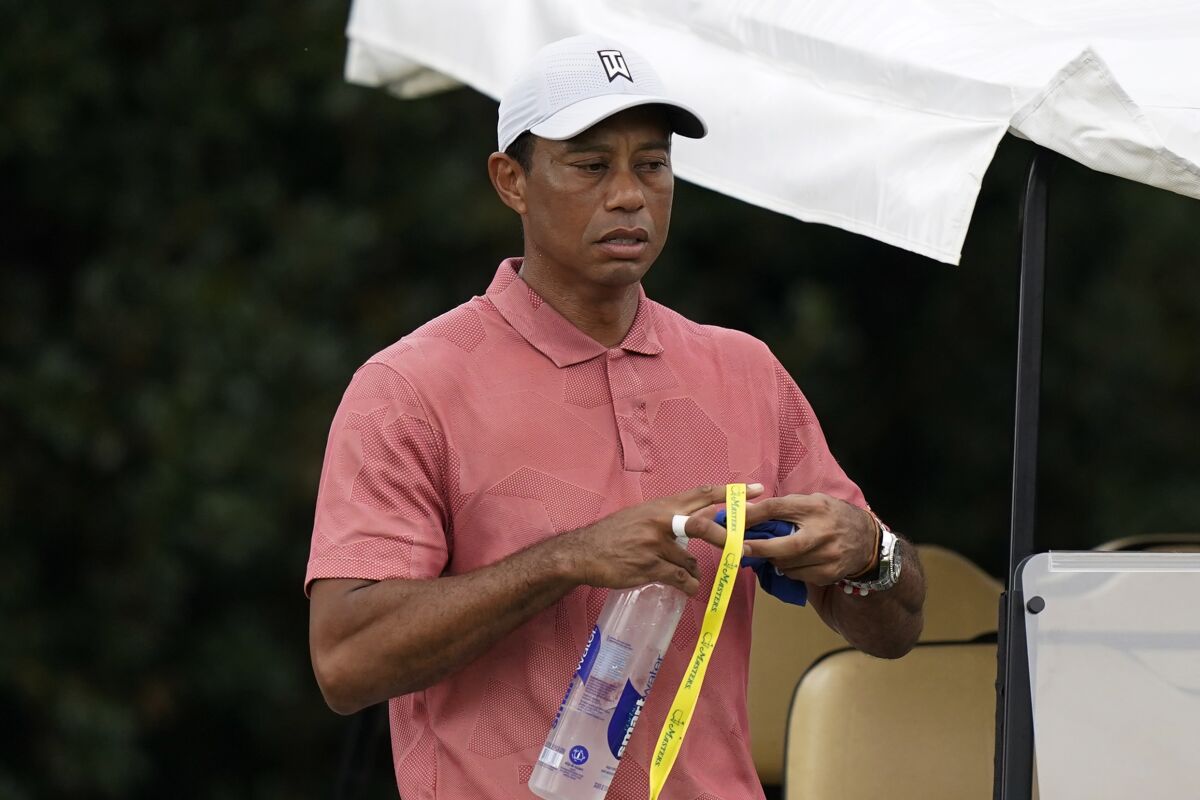 Tiger Woods leaves the driving range during a practice round for the Masters golf tournament Tuesday, Nov. 10, 2020, in Augusta, Ga. (AP Photo/David J. Phillip)