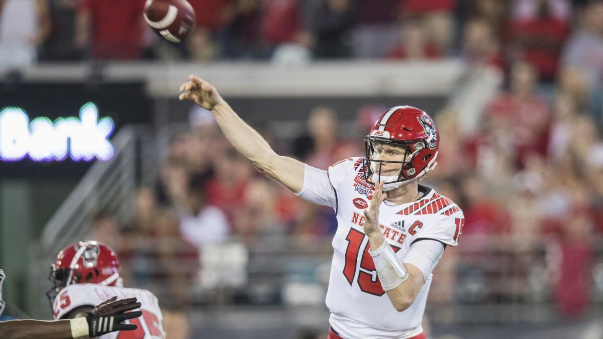 North Carolina State quarterback Ryan Finley throws a pass against Texas A&M during the first half of the Gator Bowl on Dec. 31, 2018 in Jacksonville, Fla.