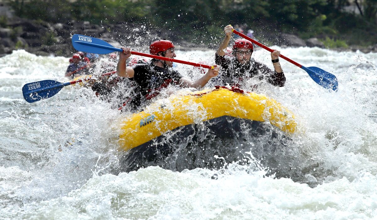 Rafters paddle through whitewater on the Upper Ocoee River near Ducktown, Tenn. 