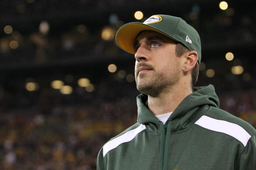 Green Bay Packers quarterback Aaron Rodgers watches from the sideline after being injured in the team's 27-20 loss to the Chicago Bears on Monday night.