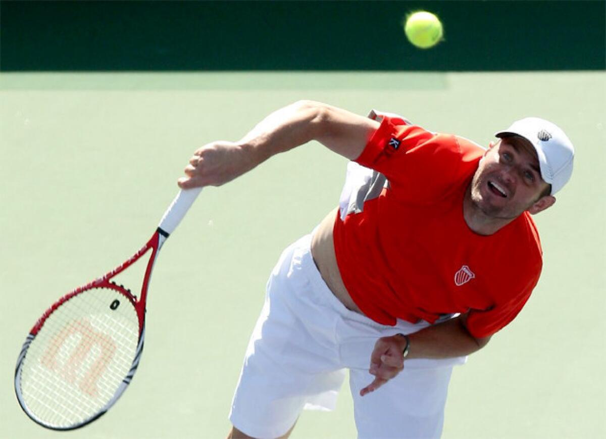 Mardy Fish beats Bobby Reynolds, 6-3, 3-6, 6-4, at the BNP Paribas Open in his first singles match in 189 days because of a heart issue.