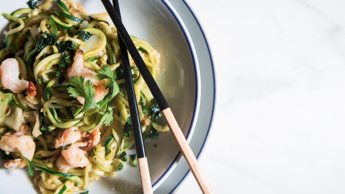 Stir-fried zucchini noodles with greens and shrimp.