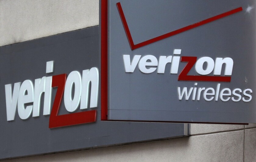Signage is on display at a Verizon Wireless retail store at Downtown Crossing in Boston.