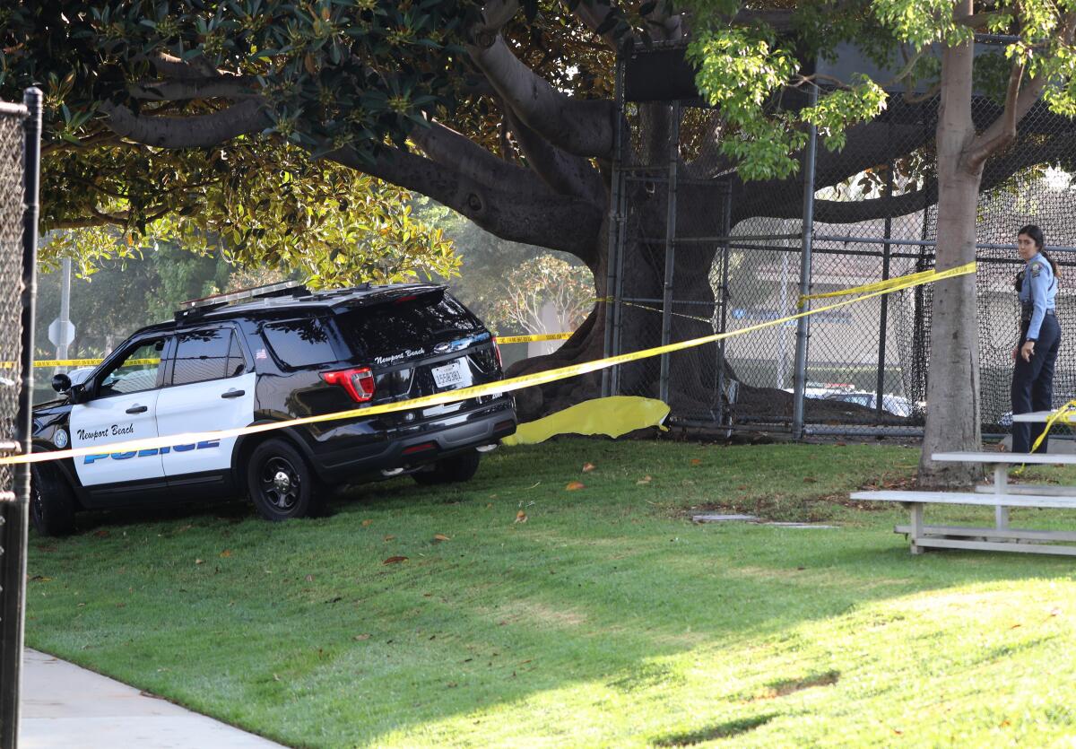 Newport Beach police investigate the scene where a person's body was found at Eastbluff Park in Newport Beach on Saturday.