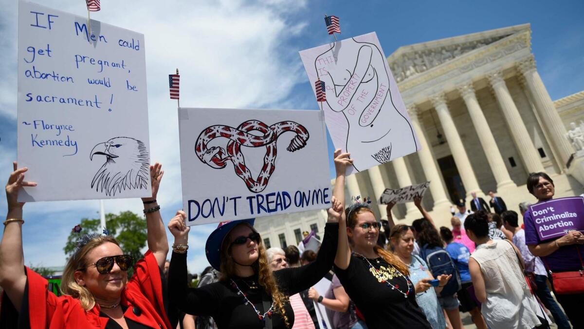 Abortion rights supporters rally in front of the Supreme Court this month.