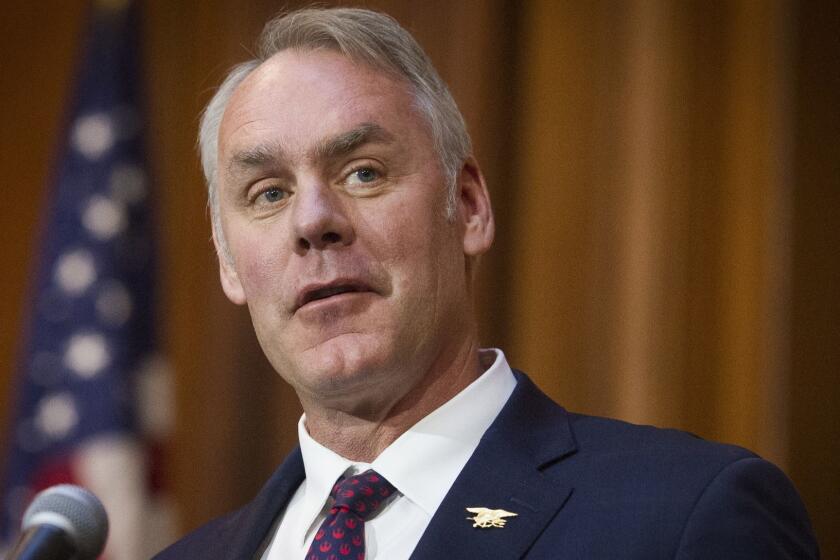 FILE - In this Dec. 11, 2018 file photo, then-Secretary of the Interior Ryan Zinke speaks at EPA headquarters in Washington. Zinke has landed a more than $100,000-a-year job with a Nevada gold-mining firm. Zinke confirmed by phone Tuesday, April 16, he has accepted a consulting and board position with U.S. Gold Corp., a company with business before Zinke's former agency, the Interior Department. (AP Photo/Cliff Owen, File)